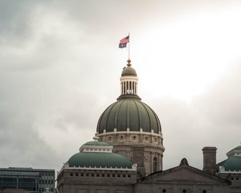 flags on top of the indiana statehouse