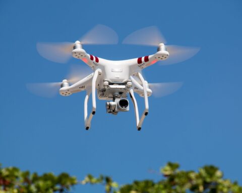 drone flying against blue sky