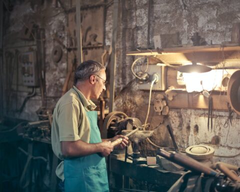 photo of man standing inside his workshop