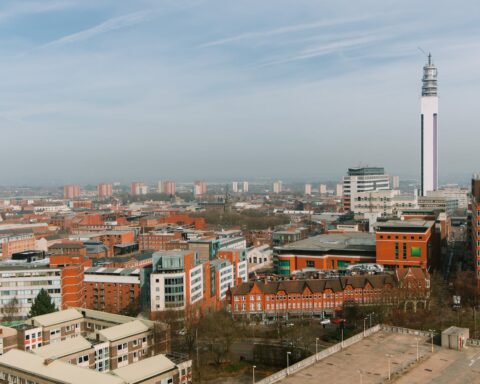 cityscape with residential buildings and tower