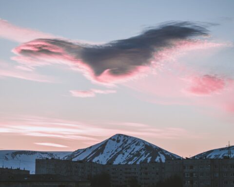 snow capped mountains during golden hour