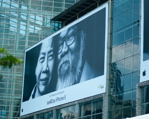 man beside woman billboard