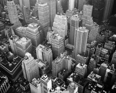 aerial view and grayscale photography of high rise buildings