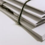 white paper folders with black tie