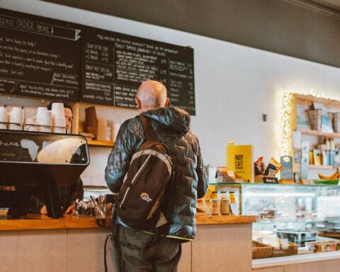 man standing in front of counter