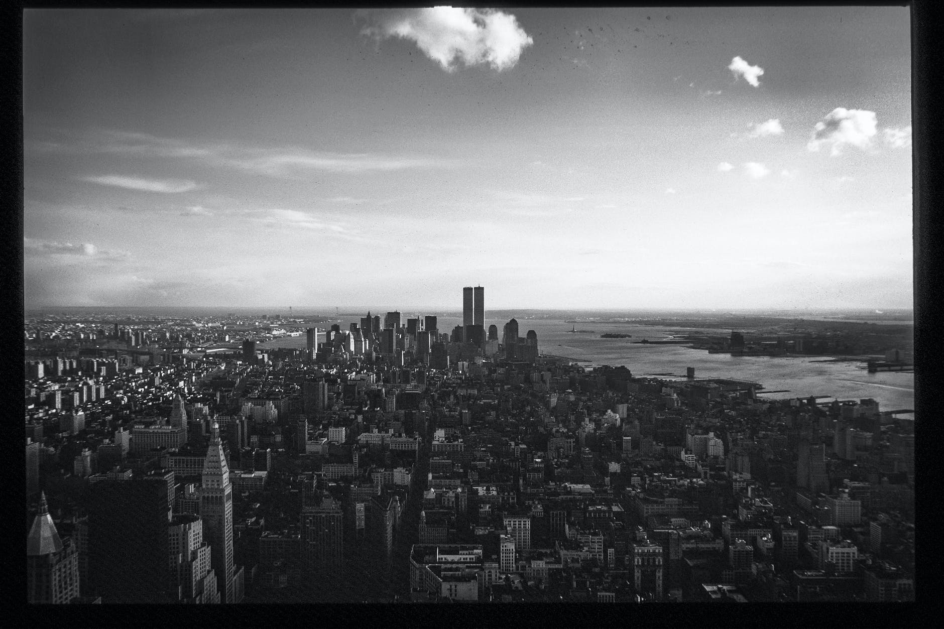 monochrome photo of city during daytime