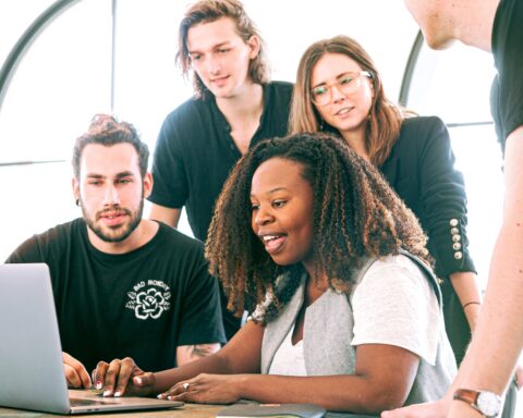 woman sharing her presentation with her colleagues