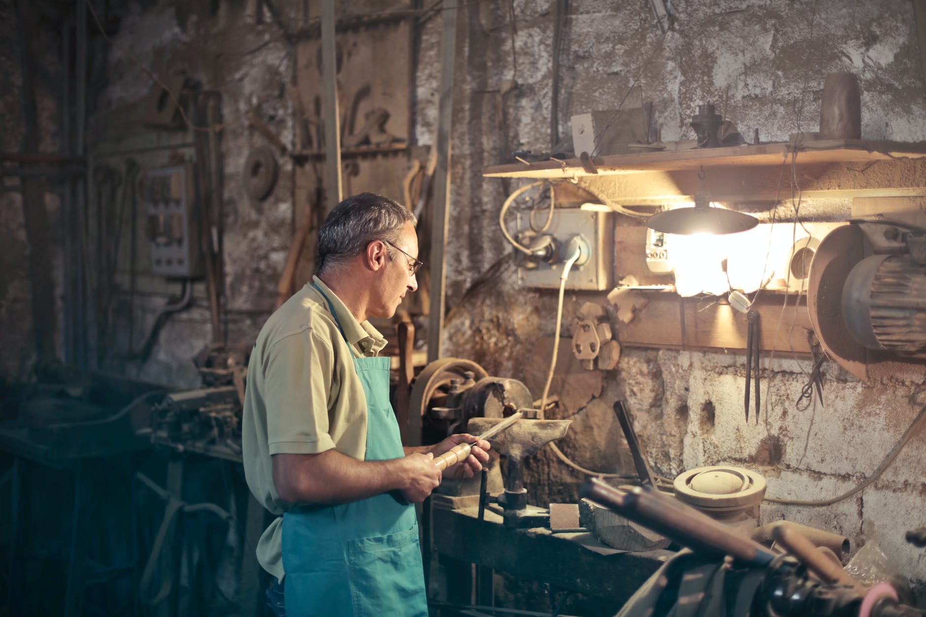 photo of man standing inside his workshop