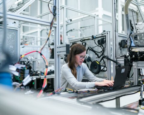 photo of female engineer working on her workspace