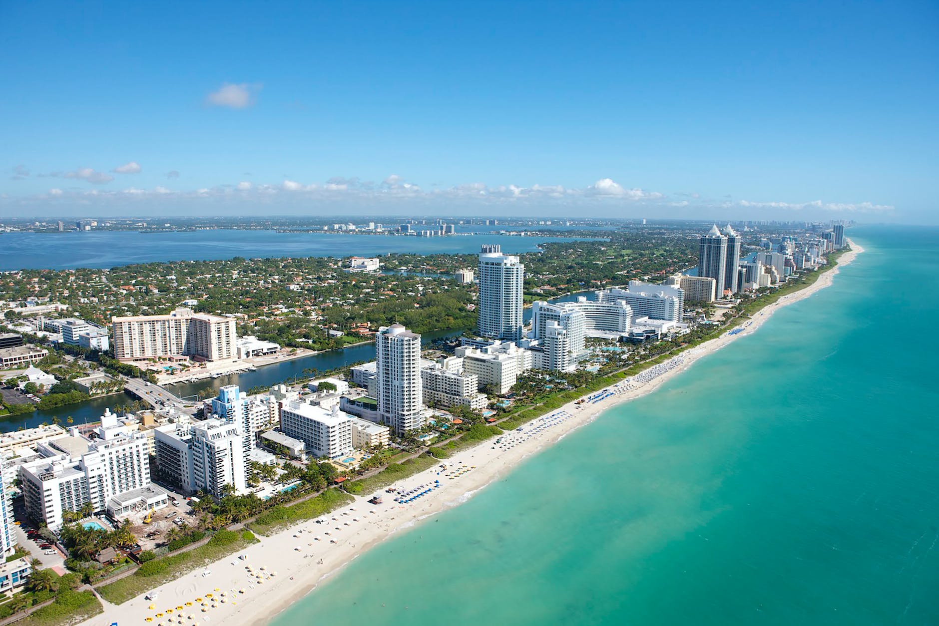 aerial view of city buildings near body of water