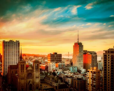 buildings under cloudy sky during sunset