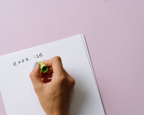 person holding white printer paper