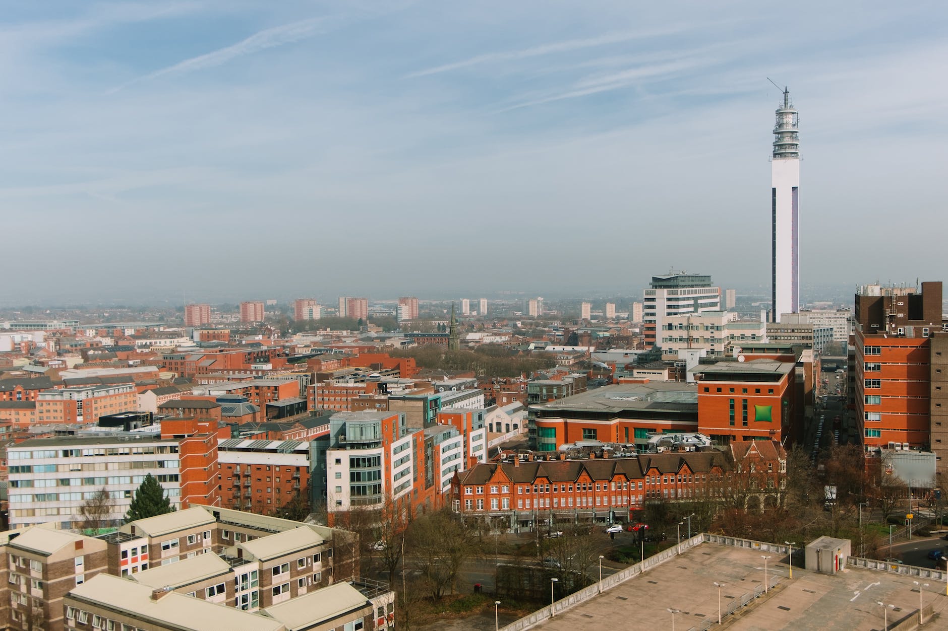 cityscape with residential buildings and tower