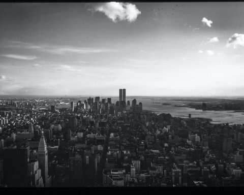 monochrome photo of city during daytime