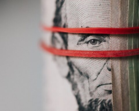 roll of american dollar banknotes tightened with band